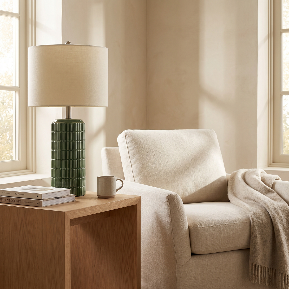 Chloe dark green lamp beside a reading chair