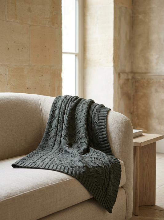 Daria Cotton Cable-Knit Throw — Charcoal — in a room
